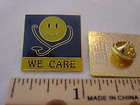 We Care Smiley Face wearing a Stethoscope Medical Pin