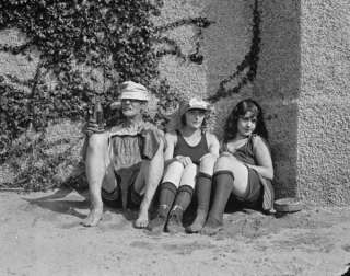 1922 photo two girls in Bathing suits sit with old man  