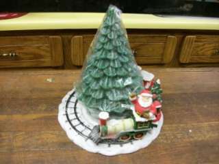 CANDLE CHRISTMAS TREE ON A CERAMIC BASE WITH 3 PIECES OF A TRAIN 