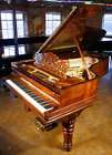 Steinway model B grand piano with a rosewood case.