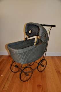 Very nice antique wicker doll carriage stroller. metal frame. rubber 